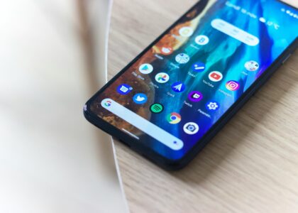 black android smartphone on brown wooden table
